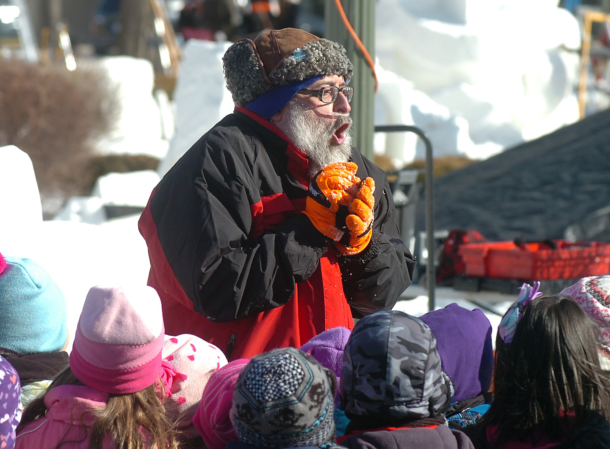 George Harnish, also known as Shamus McWeasel of the Illinois team The Kilted Snow Weasels, shares a story Friday, Jan. 30, 2015, with students on a class trip. The team is working on a piece for the at 2015 U.S. Nationals Snow Sculpting Competition in Lake Geneva. Dan Plutchak/staff.