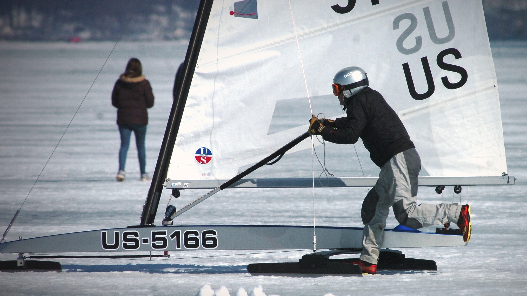 A sailor pushes his ice boat on Geneva Lake in Fontana after the wind died down. Dan Plutchak/photo.