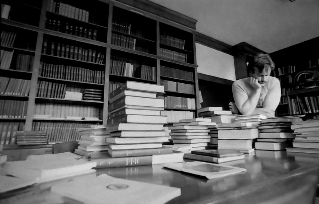 A researcher goes through a stack of books at the library of Yerkes Observatory in Williams Bay.