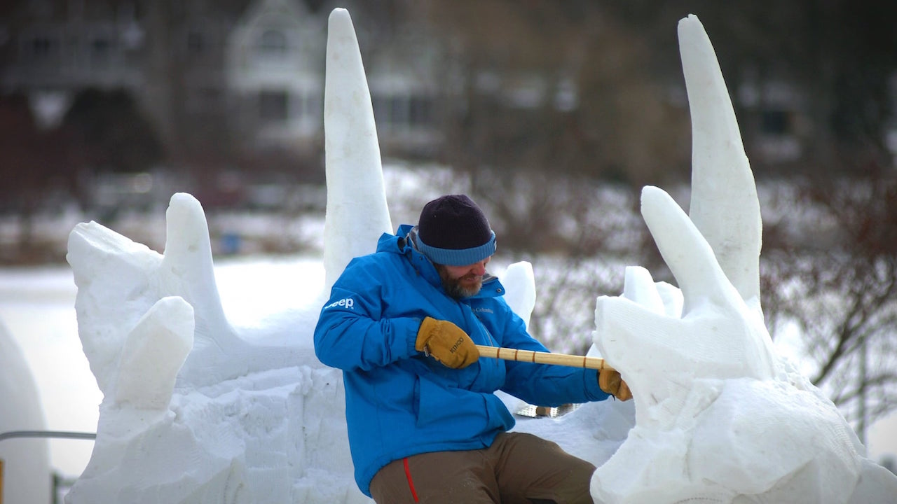 A member of team Michigan does some detail work during the 2022 U.S. National Snow Sculpting Competition in Lake Geneva. Photo by Dan Plutchak/WalworthCountyCommunityNews