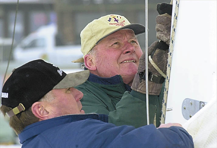 Buddy Melges, right, and Chuck Kaye of Delavan, ready Buddy's iceboat for races on Geneva Lake in 2001. The winner will take home the Hurst Cup and Stewart Cup, which had been held by Buddy since 1980. The races were sponsored by the Skeeter Ice Boat Club which was formed in Williams Bay in 1934.