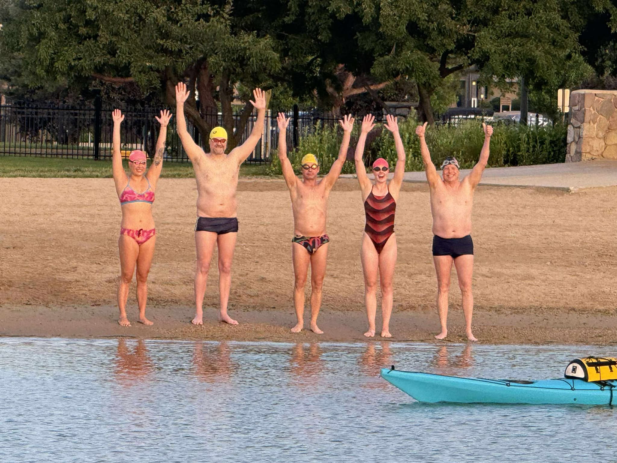 From left to right: Qing Li, David McGlynn, John Fischbach, Ella Morris and Michael Johman swam the length of Geneva Lake in 4 hours and 15 minutes. Photos courtesy of Michael Johmann